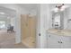 Bathroom with a single sink vanity and a shower stall, providing a functional and clean space at 866 Coopers Ridge Sw Path, Grayson, GA 30017