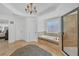 Bathroom with walk-in shower and large tub in a luxurious setting at 866 Coopers Ridge Sw Path, Grayson, GA 30017