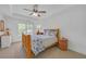 Bedroom featuring a bed, dresser, and a window looking to the outdoors at 866 Coopers Ridge Sw Path, Grayson, GA 30017
