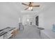 Large bedroom with trey ceilings, ceiling fan, and sitting area at 866 Coopers Ridge Sw Path, Grayson, GA 30017
