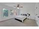 Cozy bedroom with large windows, neutral carpeting, and ample closet space for storage at 866 Coopers Ridge Sw Path, Grayson, GA 30017