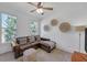 Upstairs bonus room with modern furniture, lots of natural light, and stylish decor at 866 Coopers Ridge Sw Path, Grayson, GA 30017
