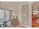 Bright exercise room featuring workout equipment, French doors, and access to outdoor space for fitness enthusiasts at 866 Coopers Ridge Sw Path, Grayson, GA 30017