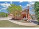 Traditional brick home with a three-car garage and covered porch at 866 Coopers Ridge Sw Path, Grayson, GA 30017