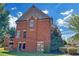 Exterior of a brick home with a view of the backyard and mature trees at 866 Coopers Ridge Sw Path, Grayson, GA 30017