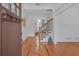 Bright foyer featuring hardwood floors, decorative inlays, and an open staircase at 866 Coopers Ridge Sw Path, Grayson, GA 30017