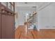 Elegant foyer with hardwood floors, white wainscoting, and a staircase with iron details at 866 Coopers Ridge Sw Path, Grayson, GA 30017