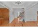 Spacious foyer featuring wood floors, white wainscoting, and views into the adjacent living spaces at 866 Coopers Ridge Sw Path, Grayson, GA 30017