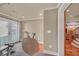 Home gym with hardwood floors and french doors leading to outdoor space, providing a bright exercise environment at 866 Coopers Ridge Sw Path, Grayson, GA 30017
