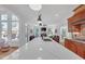 Modern kitchen with hardwood floors features a long island, stainless appliances and opens up to dual living areas at 866 Coopers Ridge Sw Path, Grayson, GA 30017