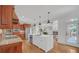 Modern kitchen featuring stainless steel appliances, a center island, and an eat-in breakfast area at 866 Coopers Ridge Sw Path, Grayson, GA 30017