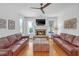 Bright living room features a stone fireplace, hardwood floors, and lots of natural light at 866 Coopers Ridge Sw Path, Grayson, GA 30017