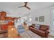 Open concept living room flows to the kitchen with hardwood floors and natural light at 866 Coopers Ridge Sw Path, Grayson, GA 30017