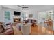 Cozy living room with fireplace, hardwood floors, and natural light, leading to dining area at 866 Coopers Ridge Sw Path, Grayson, GA 30017