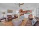 Open floor plan shows spacious living room with hardwood floors connecting to the kitchen at 866 Coopers Ridge Sw Path, Grayson, GA 30017