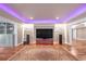 Finished basement featuring a TV and entertainment center with stone accents and recessed lighting at 866 Coopers Ridge Sw Path, Grayson, GA 30017