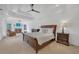 Spacious main bedroom with a fireplace, sitting area, and tray ceiling at 866 Coopers Ridge Sw Path, Grayson, GA 30017