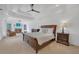 Large main bedroom with sitting area, fireplace, tray ceiling, carpet and bay window at 866 Coopers Ridge Sw Path, Grayson, GA 30017