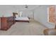 Large main bedroom with hardwood furniture and carpeted floor at 866 Coopers Ridge Sw Path, Grayson, GA 30017