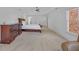 Spacious main bedroom features a large dresser, carpet, neutral paint and ceiling fan at 866 Coopers Ridge Sw Path, Grayson, GA 30017