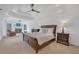 Spacious main bedroom with fireplace, tray ceiling, large windows, and neutral carpeting at 866 Coopers Ridge Sw Path, Grayson, GA 30017