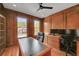 Well-lit office with custom wood paneling, built-in storage, and hardwood floors for a professional space at 866 Coopers Ridge Sw Path, Grayson, GA 30017