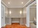 Dedicated office space with a built-in desk, drawers, granite countertop, and ample lighting for productivity at 866 Coopers Ridge Sw Path, Grayson, GA 30017
