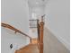 Staircase with wood railing and iron spindles with carpet on the second floor at 866 Coopers Ridge Sw Path, Grayson, GA 30017
