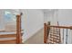 Staircase with wood railing and iron spindles leads to the second floor at 866 Coopers Ridge Sw Path, Grayson, GA 30017