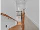 Staircase with wooden steps and a carpeted landing area leading to the upper level at 866 Coopers Ridge Sw Path, Grayson, GA 30017