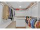 Walk-in closet with white shelving and center island at 866 Coopers Ridge Sw Path, Grayson, GA 30017