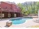Stunning backyard featuring a pool, deck, and meticulously landscaped grounds, providing an oasis of privacy at 1459 Harris Rd, Lawrenceville, GA 30043