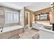 Spacious bathroom featuring a double sink vanity and separate tub and shower at 1459 Harris Rd, Lawrenceville, GA 30043