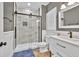 Bathroom features a glass enclosed tiled shower, sink and white wainscoting at 1459 Harris Rd, Lawrenceville, GA 30043