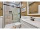 Bathroom featuring a glass door shower, white vanity, and bronze fixtures at 1459 Harris Rd, Lawrenceville, GA 30043