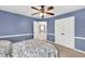 Cozy bedroom featuring a ceiling fan, carpet floors, and a double door closet at 1459 Harris Rd, Lawrenceville, GA 30043