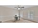 Bright bedroom with a desk, two windows with shutter blinds and carpet floors at 1459 Harris Rd, Lawrenceville, GA 30043