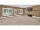 Large bonus room with three windows, and neutral carpet floors at 1459 Harris Rd, Lawrenceville, GA 30043