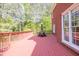 Expansive outdoor deck with dining set, perfect for entertaining and enjoying serene views of the surrounding trees at 1459 Harris Rd, Lawrenceville, GA 30043