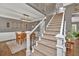 Elegant dining area with a staircase, stylish lighting, and room for entertaining at 1459 Harris Rd, Lawrenceville, GA 30043