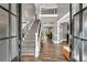 Grand foyer with a staircase, hardwood floors, and a view into the living spaces at 1459 Harris Rd, Lawrenceville, GA 30043