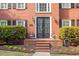 Charming brick home with a welcoming front entrance, manicured landscaping, and black shutters at 1459 Harris Rd, Lawrenceville, GA 30043
