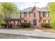 Stately brick home with meticulously landscaped front yard and inviting double door entrance at 1459 Harris Rd, Lawrenceville, GA 30043