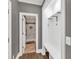 Hallway area with storage and a view into the marble tiled shower room at 1459 Harris Rd, Lawrenceville, GA 30043
