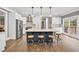 Modern kitchen features a large island, stainless steel appliances, and white cabinetry at 1459 Harris Rd, Lawrenceville, GA 30043
