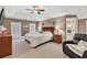 Spacious primary bedroom with plush carpeting, tray ceiling, and ample natural light at 1459 Harris Rd, Lawrenceville, GA 30043