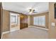 Bedroom boasts a sliding barn door leading to an ensuite bathroom and shuttered windows at 1459 Harris Rd, Lawrenceville, GA 30043