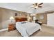 Spacious main bedroom features a tray ceiling and a comfortable seating area at 1459 Harris Rd, Lawrenceville, GA 30043