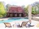 Inviting backyard with a sparkling pool, lounge chairs, patio, and lush greenery, perfect for relaxation at 1459 Harris Rd, Lawrenceville, GA 30043
