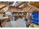 Workshop with wooden beams, tools, and concrete floors at 1459 Harris Rd, Lawrenceville, GA 30043